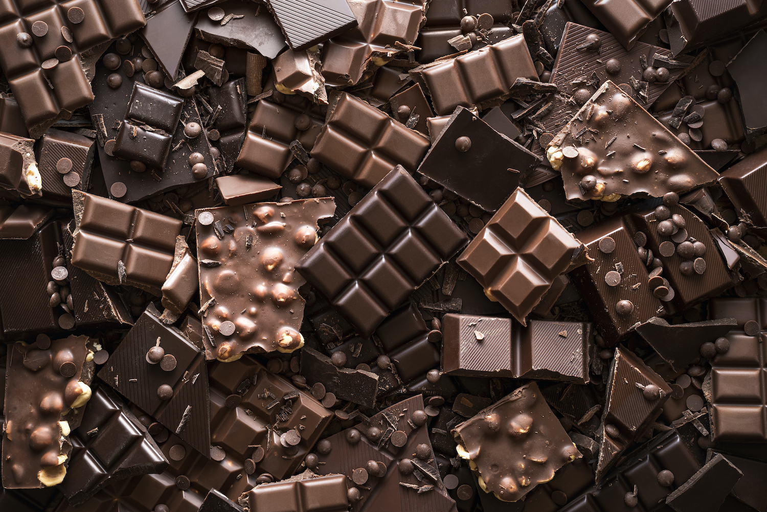 Assorted Chocolate Bar And Chunks, Background. Flat Lay With Chocolate Variety. Chocolate Collection