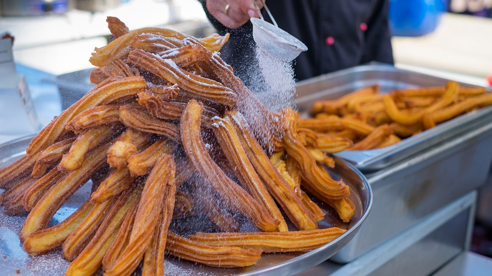 Delicious churros sticks deep fried and dusted with powdered sug