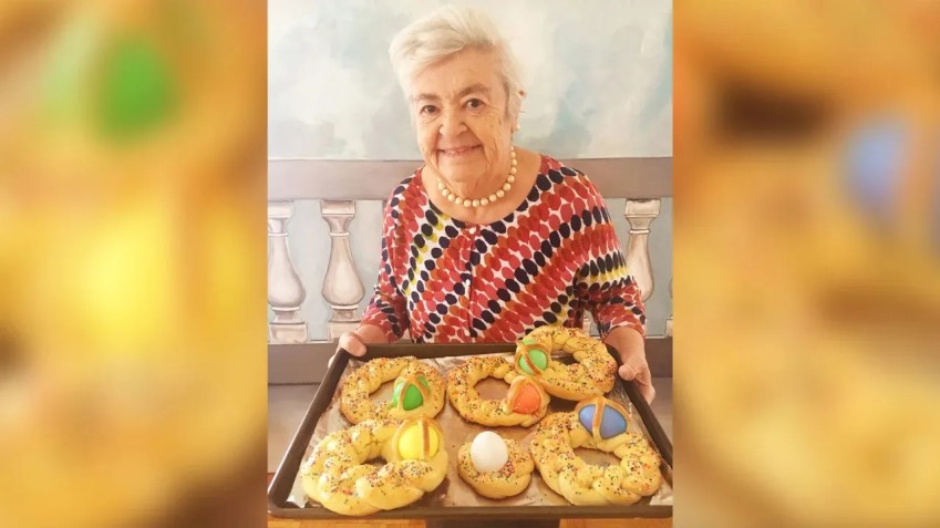 Nonna Romana segura o rarella, um pão de Páscoa trançado decorado com ovos cozidos coloridos. Sua neta, Rossella Rago, disse que Romana os fazia toda Páscoa para todas as crianças / Rossella Rago/Arquivo Pessoal