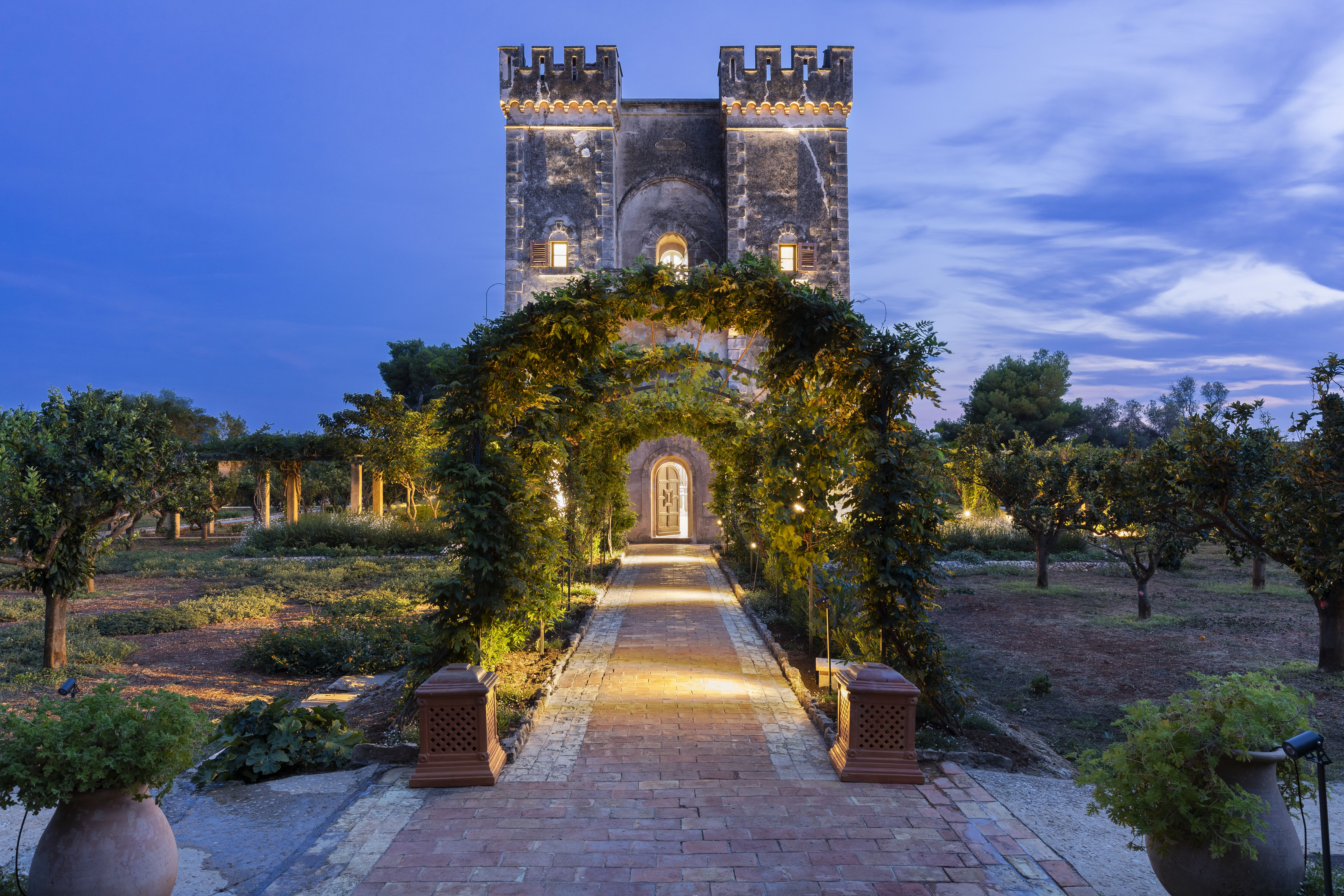 A lush archway beckons guests to explore and unwind. Le Grand Jardin