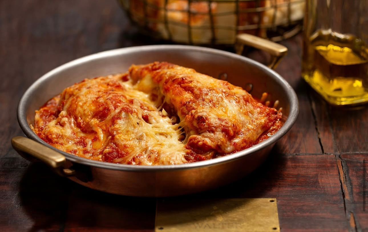 Na Famiglia Mancini, o cliente encontrará entre as sugestões três tipos de à parmegiana. Na foto, a tradicional berinjela • Reprodução Instagram